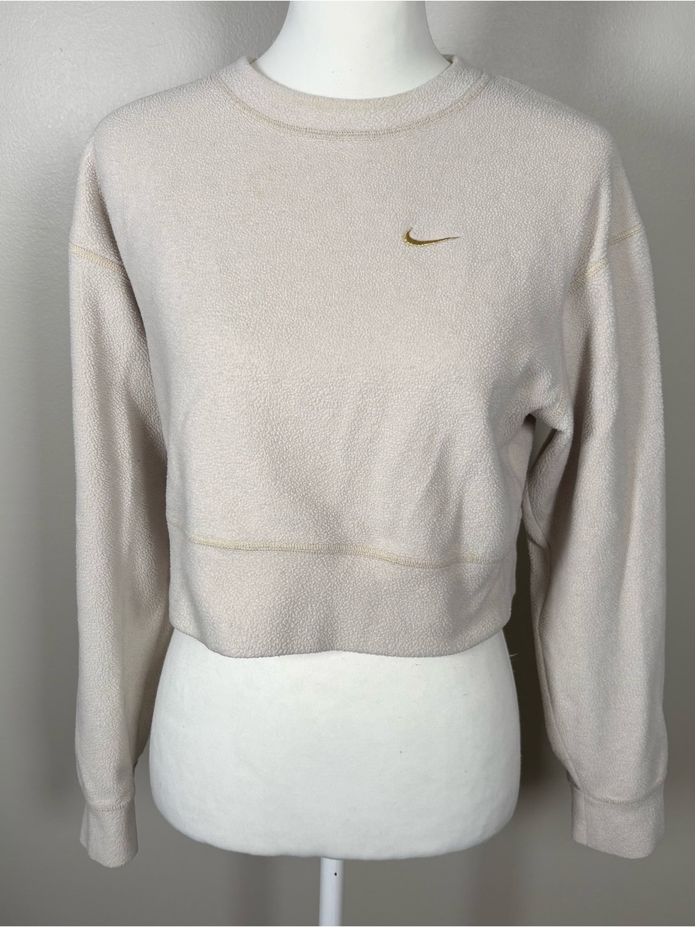 Nike Women's Cream Cropped Fleece Sweatshirt with Gold Swoosh